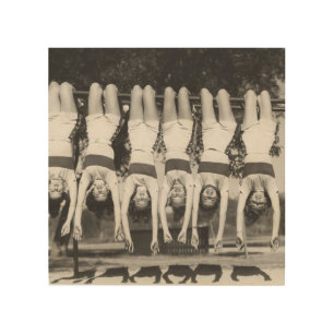 Showgirls on monkey bars, playful design. wood wall art