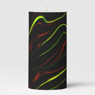 Showy green and red long wavy traces on black fund pillar candle