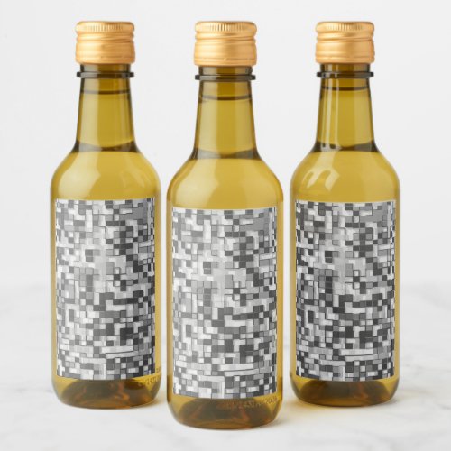 Shuffled small squares in tones of gray to clear wine label