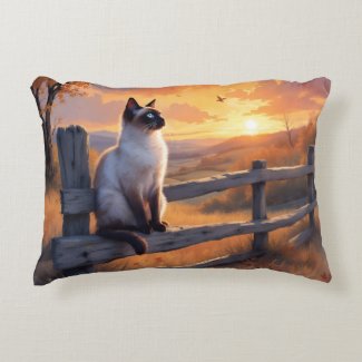 Siamese cat on split rail fence