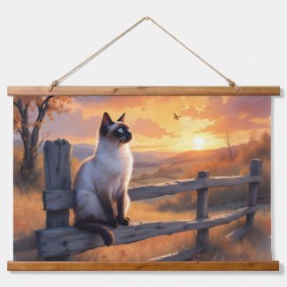 Siamese cat on split rail fence