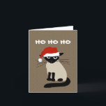 Siamese Santa Clause - Funny Kitty Cat Christmas Holiday Card<br><div class="desc">Ho Ho Ho. Funny Siamese cat wearing a Santa Clause hat. This annoyed kitty says Bah Humbug to wearing a ridiculous hat. This funny Christmas card can be personalized with your own greeting. A fun cat lover’s holiday card purrfect for both personal and business holiday mailings. Great for pet sitters,...</div>