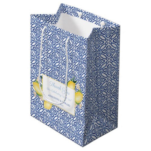 Sicilian Lemons Blue Tiles Wedding Favor Medium Gift Bag - Watercolor lemons against a backdrop of a vintage blue and white pattern design. The text is in pale blue and cobalt blue and all of it can be personalized. You can also add or delete text boxes inside the design tool. 