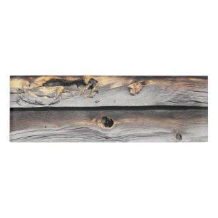 signed by the weather as old wood background name tag