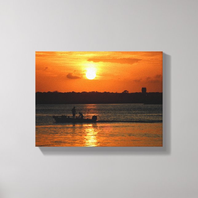 Silhouette of a boat at sunset canvas print (Front)