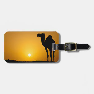 Silhouette of a wild camel at sunset luggage tag