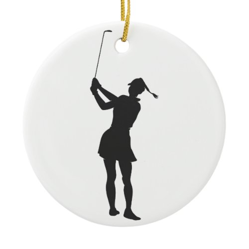 Silhouette of a woman playing golf ceramic ornament