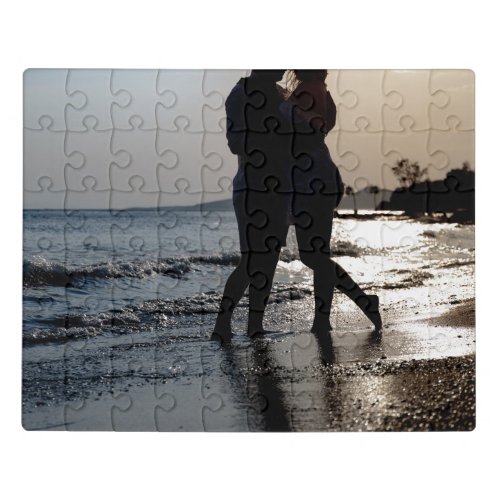 Silhouette of a young romantic couple kisses jigsaw puzzle