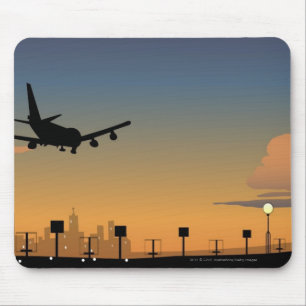Silhouette of an airplane in flight mouse pad
