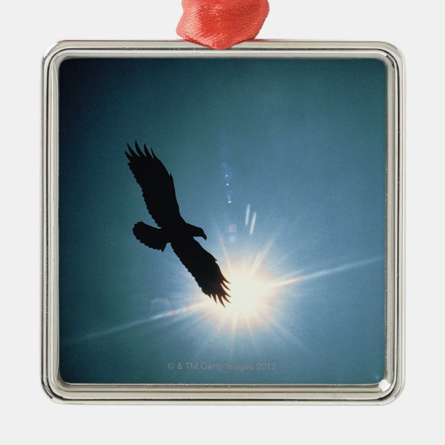 Silhouette of bald eagle flying in sky metal ornament (Front)