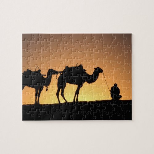 Silhouette of camel caravan on the desert at 2 jigsaw puzzle