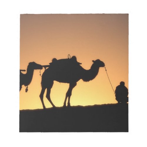 Silhouette of camel caravan on the desert at 2 notepad