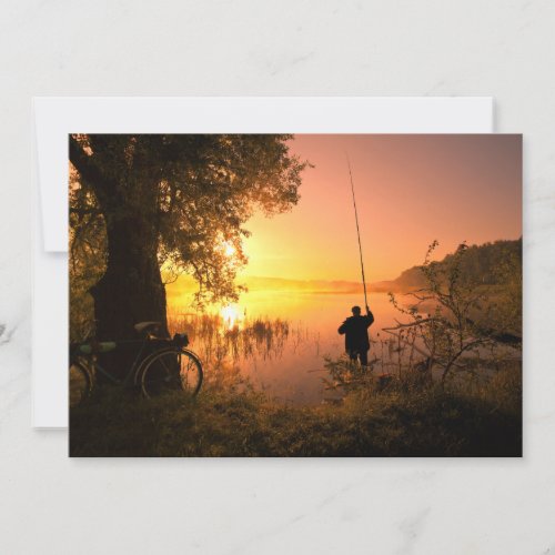 Silhouette of Fisherman on Lake at Sunset