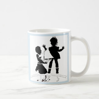 silhouette of girl and boy and model boat coffee mug