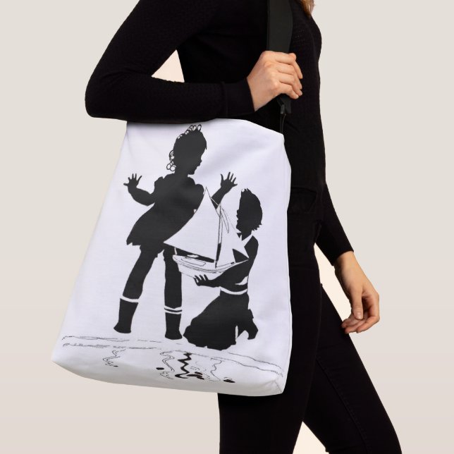 silhouette of girl and boy and model boat crossbody bag (Close Up)