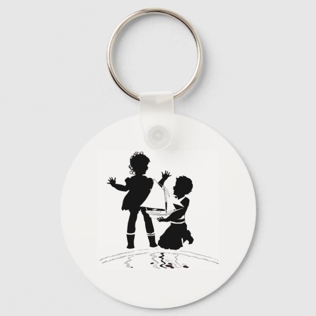 silhouette of girl and boy and model boat keychain (Front)