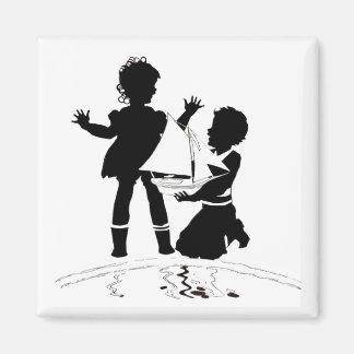 silhouette of girl and boy and model boat magnet