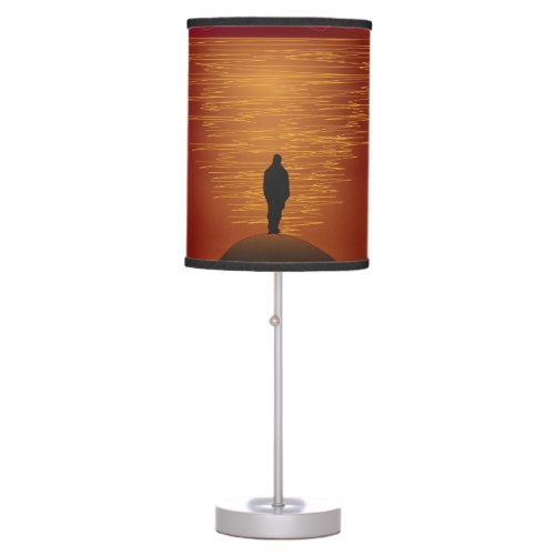 SILHOUETTE OF MAN STANDING AT ROCK TABLE LAMP