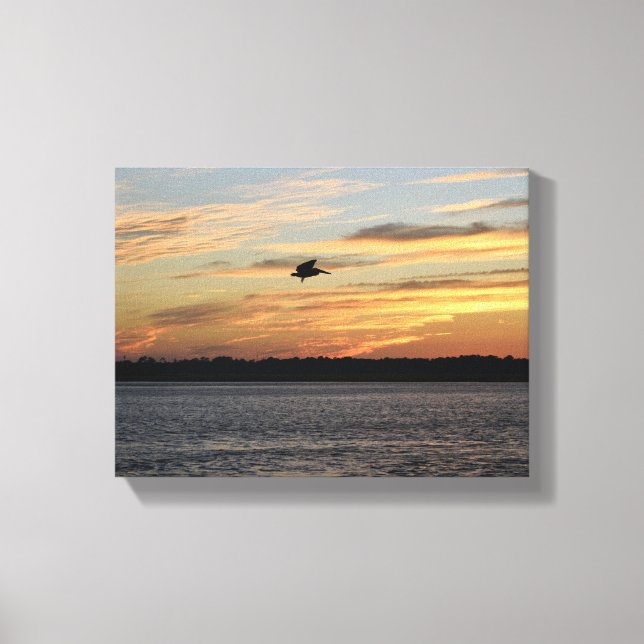 Silhouette of pelican flying over the river canvas print (Front)