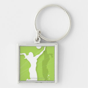 Silhouette of two women playing volleyball keychain