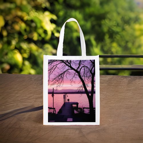 Silhouetted Couple on Dock with Pink Sunset Sky Grocery Bag