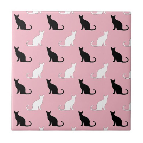 Silhouettes Of Black and White Cats On Pink Ceramic Tile
