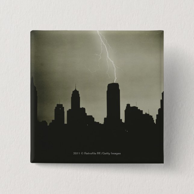 Silhouettes of skyscrapers and lightning in sky pinback button (Front)