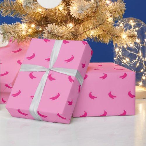 Silhouettes of Small Intense Pink Bananas on Pink Wrapping Paper