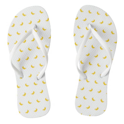 Silhouettes of Small Yellow Bananas on White Flip Flops