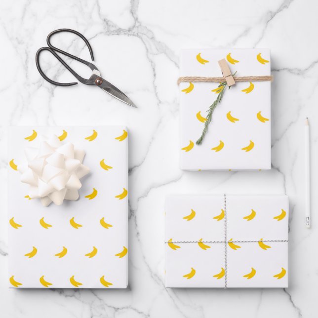 Silhouettes of Small Yellow Bananas on White Wrapping Paper Sheets (Front)