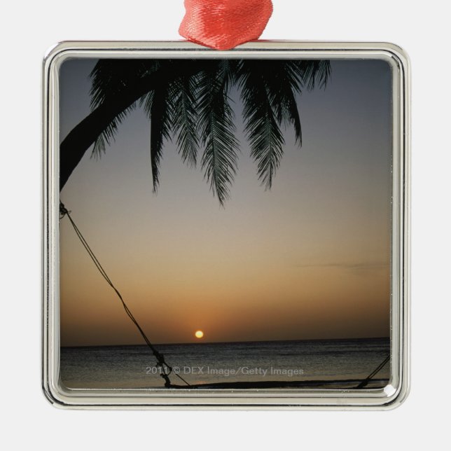 Silhuetted empty hammock at sunset metal ornament (Front)