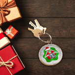 Silly Christmas Skeleton Ornaments Santa Hat Green Keychain<br><div class="desc">This key chain has a silly Christmas skeleton looking out from an abstract bright red and green splatter shape holding two round ornaments up to his eyes wearing a red fur trimmed Santa Hat on a white abstract background with circles.</div>