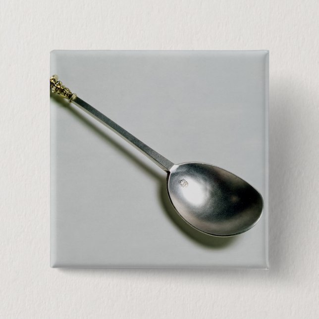 Silver apostle spoon with gold seal top, 1668 pinback button (Front)