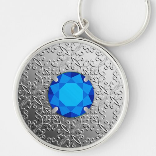 Silver Damask with a faux sapphire gemstone Keychain