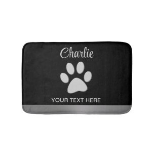 Silver Dog Paw on black background Bath Mat