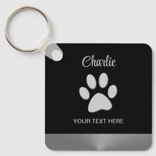 Silver Dog Paw on black background Keychain