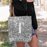 Silver Faux Glitter Bokeh Sparkles Monogram Tote Bag<br><div class="desc">A modern bold single letter monogram in white with a black drop shadow. The font size, color and style are customizable. The background is a faux silver grey glitter with sparkly spots or bokeh. Move or delete the tiny faux sparkle graphic images. Silvery grey gift for a bridesmaid or other...</div>