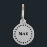 Silver Gray Pet ID Tag With Paw Prints<br><div class="desc">Silver gray pet ID Tag with paw prints. Personalize by replacing the sample name Max with your pet's name or custom pet name and by replacing the sample text on the back with your contact information.</div>