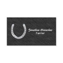 Silver horseshoe on black denim