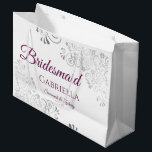 Silver Lace Cassis Purple White Bridesmaid Wedding Large Gift Bag<br><div class="desc">These beautiful gift bags are designed as a wedding gift or favor bag for your Bridesmaids. They feature a simple yet elegant design with silver faux foil lace frills and cassis purple, magenta, or berry colored text reading "Bridesmaid" written in fancy script letters. There is also a place to enter...</div>