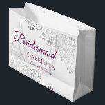 Silver Lace Cassis Purple White Bridesmaid Wedding Large Gift Bag<br><div class="desc">These beautiful gift bags are designed as a wedding gift or favor bag for your Bridesmaids. They feature a simple yet elegant design with silver faux foil lace frills and cassis purple, magenta, or berry colored text reading "Bridesmaid" written in fancy script letters. There is also a place to enter...</div>
