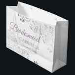 Silver Lace Lavender on White Bridesmaid Wedding Large Gift Bag<br><div class="desc">These beautiful gift bags are designed as a wedding gift or favor bag for your Bridesmaids. They feature a simple yet elegant design with silver faux foil lace frills and dusty purple or lavender colored text reading "Bridesmaid" written in fancy script letters. There is also a place to enter her...</div>