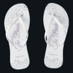 Silver Lace & Lavender Script The Bride Wedding Flip Flops<br><div class="desc">Dance the night away with these beautiful wedding flip flops. Designed for the bride, they feature a simple yet elegant design with dusty purple or lavender script lettering on a white background and fancy silver gray lace curls and swirls. Beautiful way to stay fancy and appropriate while giving your feet...</div>