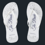 Silver Lace Navy Blue on White The Bride Wedding Flip Flops<br><div class="desc">Dance the night away with these beautiful wedding flip flops. Designed for the bride, they feature a simple yet elegant design with navy blue script lettering on a white background and fancy silver gray lace curls and swirls. Beautiful way to stay fancy and appropriate while giving your feet a break...</div>