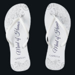 Silver Lace Navy on White Maid of Honor Wedding Flip Flops<br><div class="desc">These beautiful wedding flip flops are a great way to thank and recognize your Maid of Honor while saving her feet at the same time. Features an elegant design with silver gray lace on a white background and fancy navy blue colored script lettering. The test reads Maid of Honor with...</div>