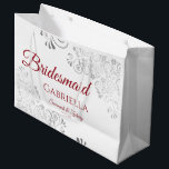 Silver Lace Red on White Bridesmaid Wedding Large Gift Bag<br><div class="desc">These beautiful gift bags are designed as a wedding gift or favor bag for your Bridesmaids. They feature a simple yet elegant design with silver faux foil lace frills and crimson red text reading "Bridesmaid" written in fancy script letters. There is also a place to enter her name, the couple's...</div>