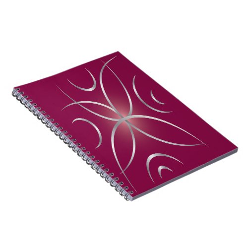 Silver on magenta notebook