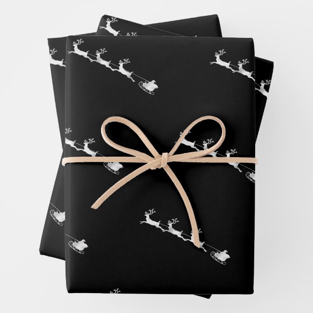 silver reindeer christmas pattern black background wrapping paper sheets (In situ)