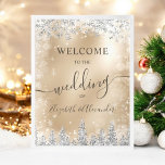 Silver snow pine gold Christmas winter wedding Poster<br><div class="desc">Welcome guests to your winter wedding with this elegant sign featuring faux silver glitter shimmering snowflakes and a forest of frosted pine trees. Set against a faux metallic gold foil background, the design exudes a magical winter wonderland ambiance. Perfect for a Christmas or winter wedding, this sign sets the tone...</div>