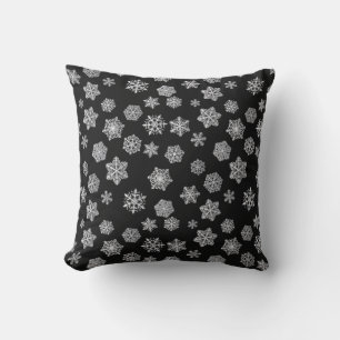 Silver snowflakes on a black background throw pillow